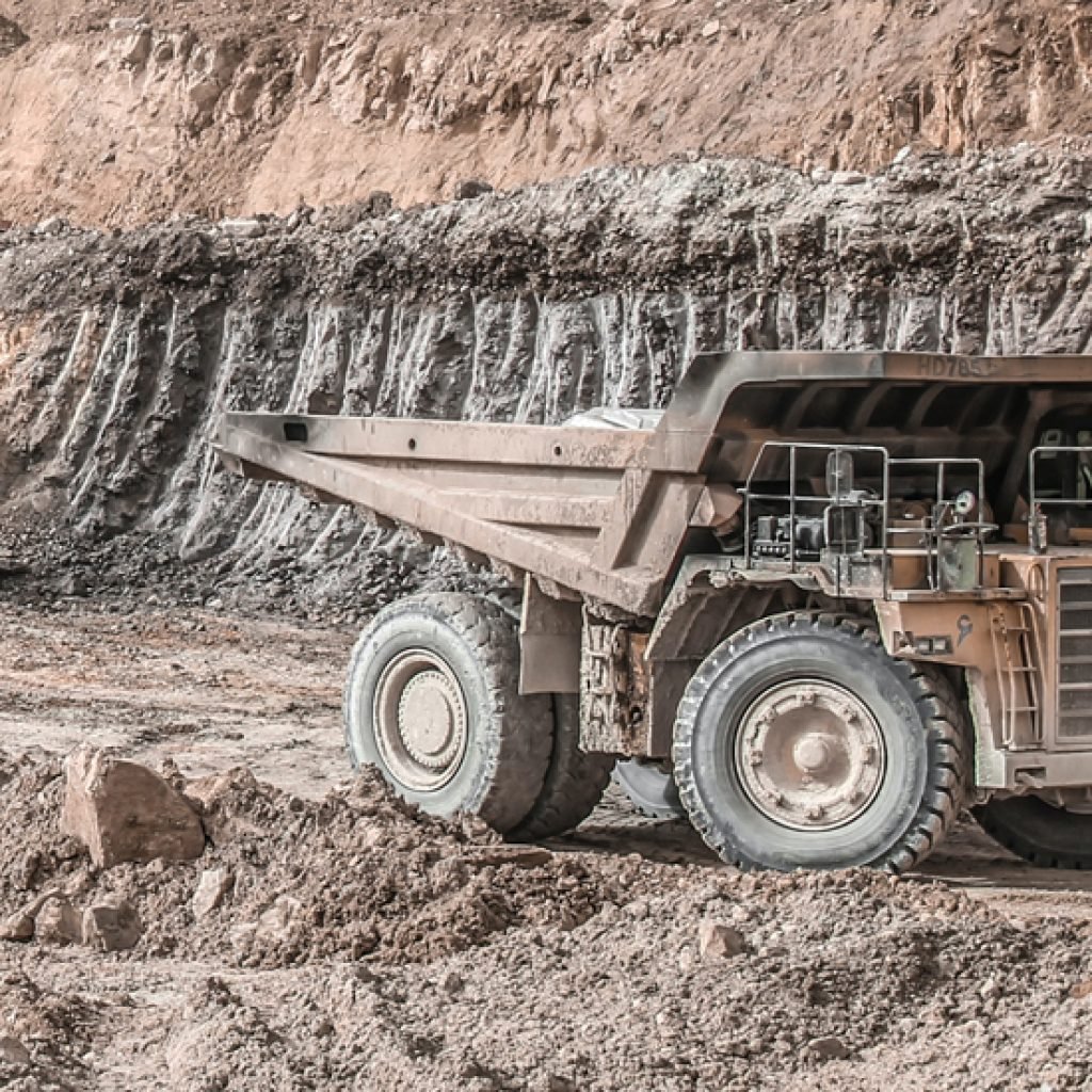 Loadscan solutions in action measuring haul truck loads in a quarry with a large dump truck operating on a mining site.