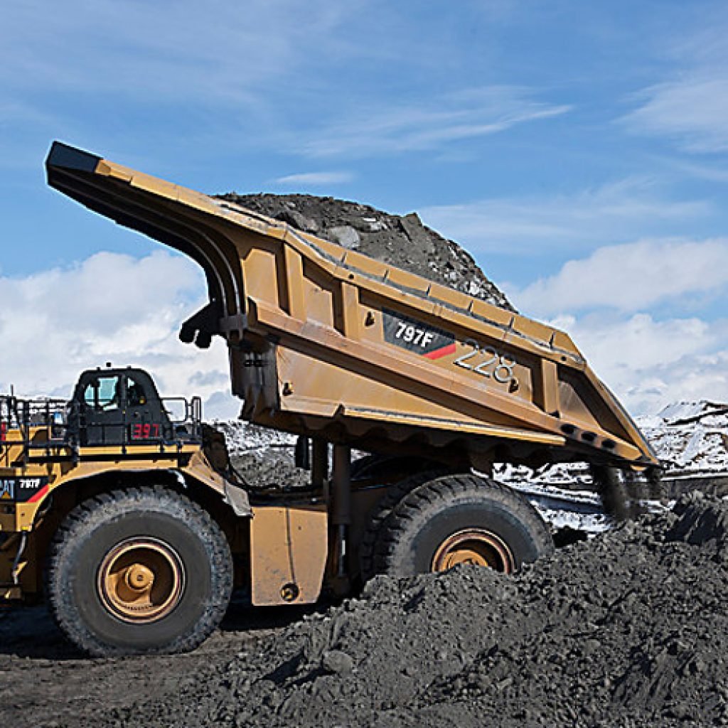 Heavy-duty mining truck carrying a full load, equipped with loadrite retrofits to optimise payload accuracy and reduce operational costs.