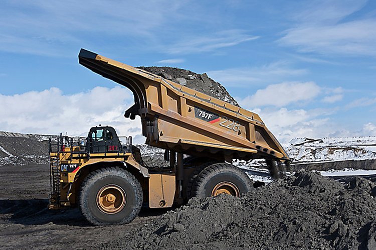 Heavy-duty mining truck carrying a full load, equipped with loadrite retrofits to optimise payload accuracy and reduce operational costs.